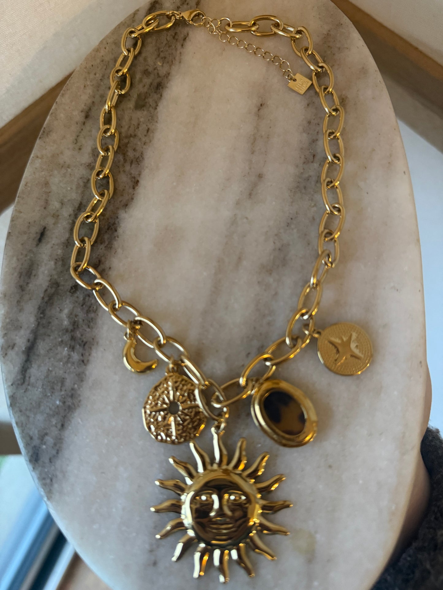 Collier breloque soleil