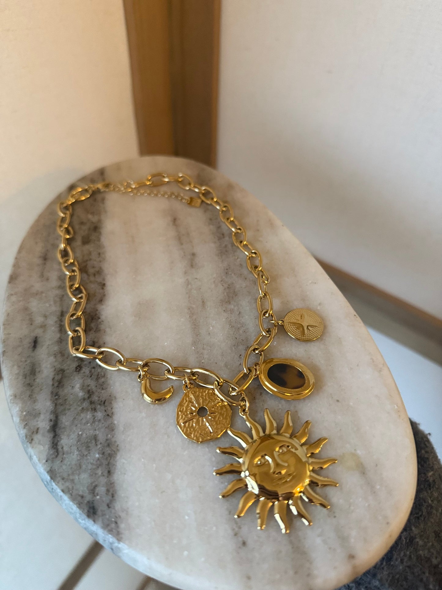 Collier breloque soleil