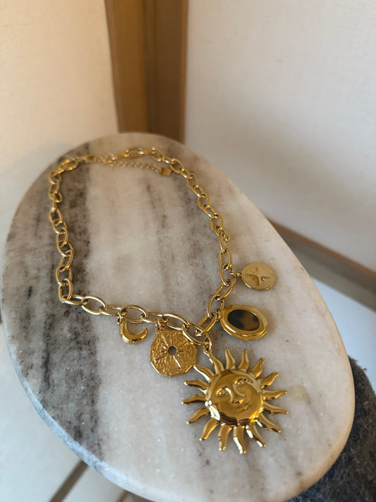 Collier breloque soleil